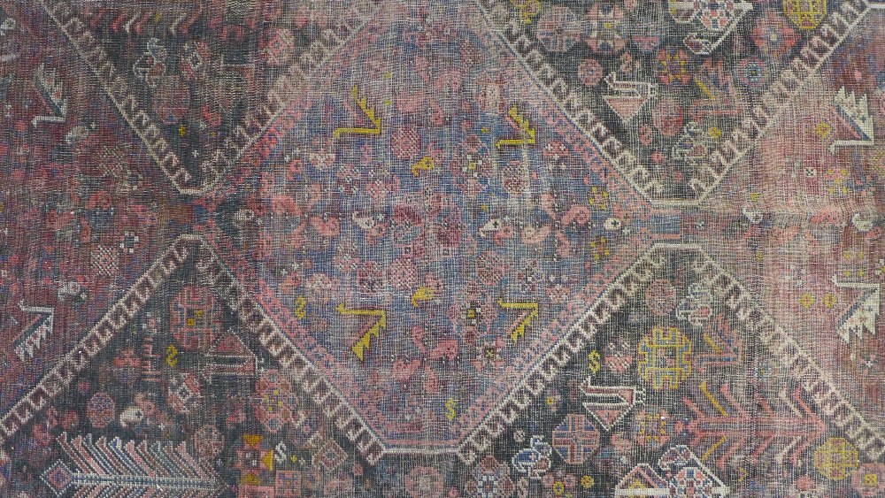Late 19th / early 20th century Persian rug, three hooked medallions to a foliate ground within - Image 3 of 6