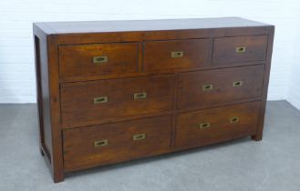 Contemporary hardwood chest of drawers, with campaign style brass handles, 160 x 90 x 45cm.
