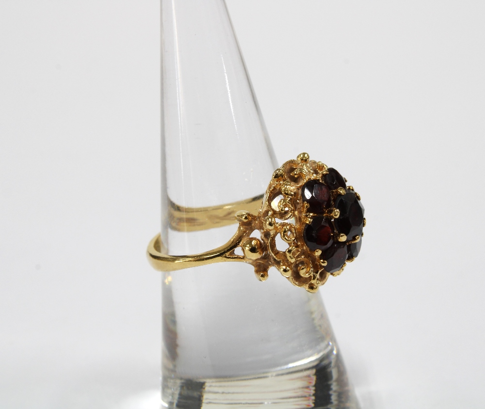 18ct gold bracelet with eleven panels, each with a group of seven garnets in a flowerhead setting, - Image 7 of 8