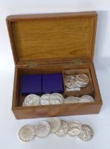 A silver topped wooden box containing a quantity of Scottish National Fat Stock Club medallions, etc
