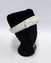 CHRISTIAN DIOR, vintage hat in black velvet with white leather band and bow, labelled Christian Dior