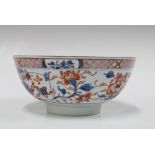 Chinese porcelain bowl painted with flowers and foliage with a plain footrim, 20 x 9cm.