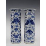 A pair of Chinese blue and white sleeve vases, with birds and butterfly pattern, Kangxi marks but