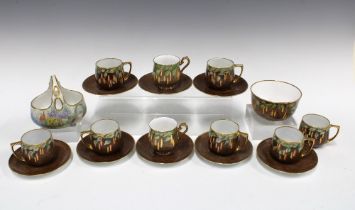 An early 20th century handpainted set of Czechoslovakia cups and saucers with a matching sugar