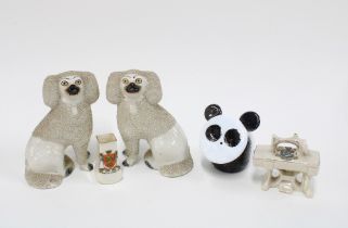 A pair of Staffordshire poodles, novelty glass panda and two crested ware porcelain miniatures (5)
