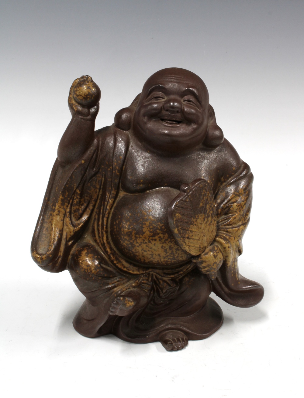 Brown glazed stoneware Buddha, 19 x 23cm.
