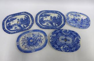 Five Staffordshire blue and white transfer printed mazarine drainers, largest 34cm (5)