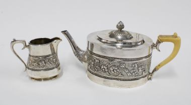 Victorian silver teapot with faux ivory handle and a matching cream jug, Walker Crichton,