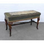 Mahogany double piano stool, with tapestry upholstered lift up top, raised on elaborately carved