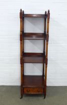 Mahogany four tier whatnot with a single drawer to the base, on brass casters, 48 x 163 x 48cm.