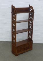 Mahogany open bookcase, narrow proportions with fretwork sides, with four small drawers, 52 x 111