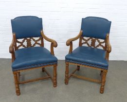 Pair of early 20th century oak open arm chairs, 61 x 99 x 50cm. (2)