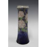 Royal Doulton vase by Lily Partington, blue ground with a pink roses and foliage, , impressed