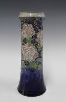 Royal Doulton vase by Lily Partington, blue ground with a pink roses and foliage, , impressed