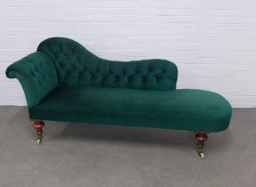 Green buttonback upholstered chaise-lounge, on mahogany legs with ceramic castors, 196 x 88 x 66cm.
