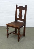 Oak hall chair with carved splat and solid seat, 48 x 99 x 45cm.