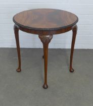 Wylie & Lochhead mahogany table, quarter veneered circular top with shell carved cabriole legs, 70 x