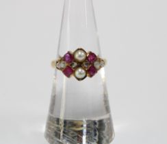 18ct gold cluster ring set with six old cut diamonds, two pearls and four rubies, stamped 18ct