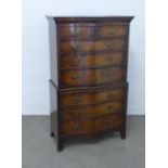 Mahogany reproduction serpentine chest on chest, the base with a pull out slide, 89 x 152 x 49cm.