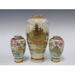 A garniture of Japanese earthenware vases, with pagoda pattern and signed with character makrs, to