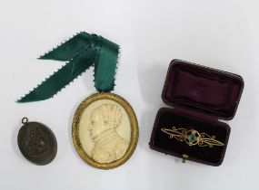 Early 20th century 9ct gold brooch, black cameo pendant and a faux ivory plaque (3)