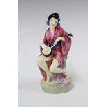 An early Royal Doulton figure of a Geisha girl with banjo, printed backstamp and impressed marks, (
