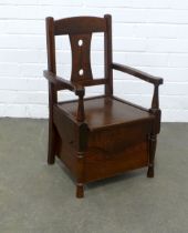 An early 20th century mahogany child's commode chair, 37 x 61 x 32cm.