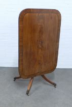 Mahogany tilt top breakfast table with a cross banded top on a pedestal base with splayed legs