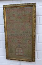Alphabet and house needlework sampler, framed under glass 22 x 43cm