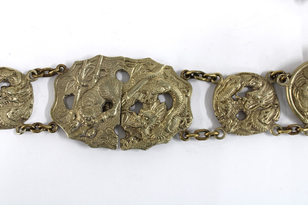 Chinese white metal belt, with thirteen dragon and Buddhistic lion panels with a central two part - Image 2 of 5