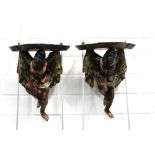 A pair of painted giltwood Blackamore style wall bracket shelves (2) 22 x 29cm.