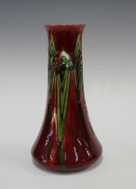 Minton Secessionist No1 slender baluster vase, tube lined with stylised flowers to a deep red