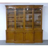 Large oak breakfront library bookcase, early 20th century, cornice top with acorn carving over