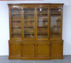Large oak breakfront library bookcase, early 20th century, cornice top with acorn carving over