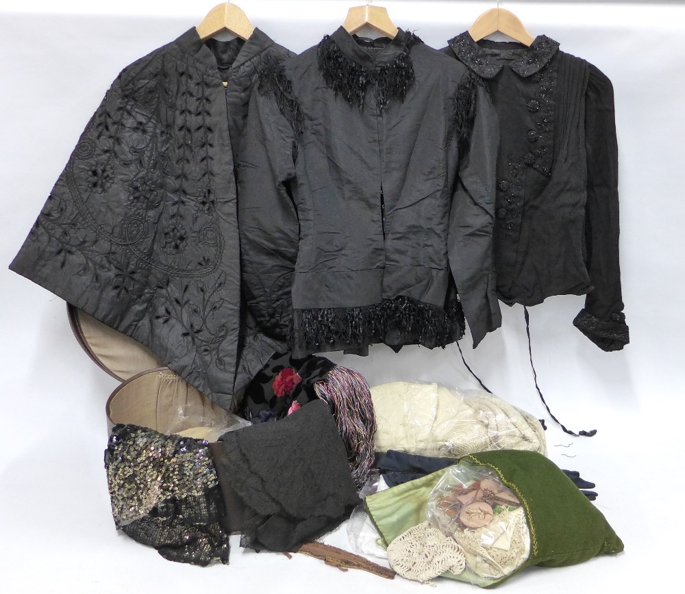 Collection of late 19th / early 20th century clothing to include three black capes, a vinta