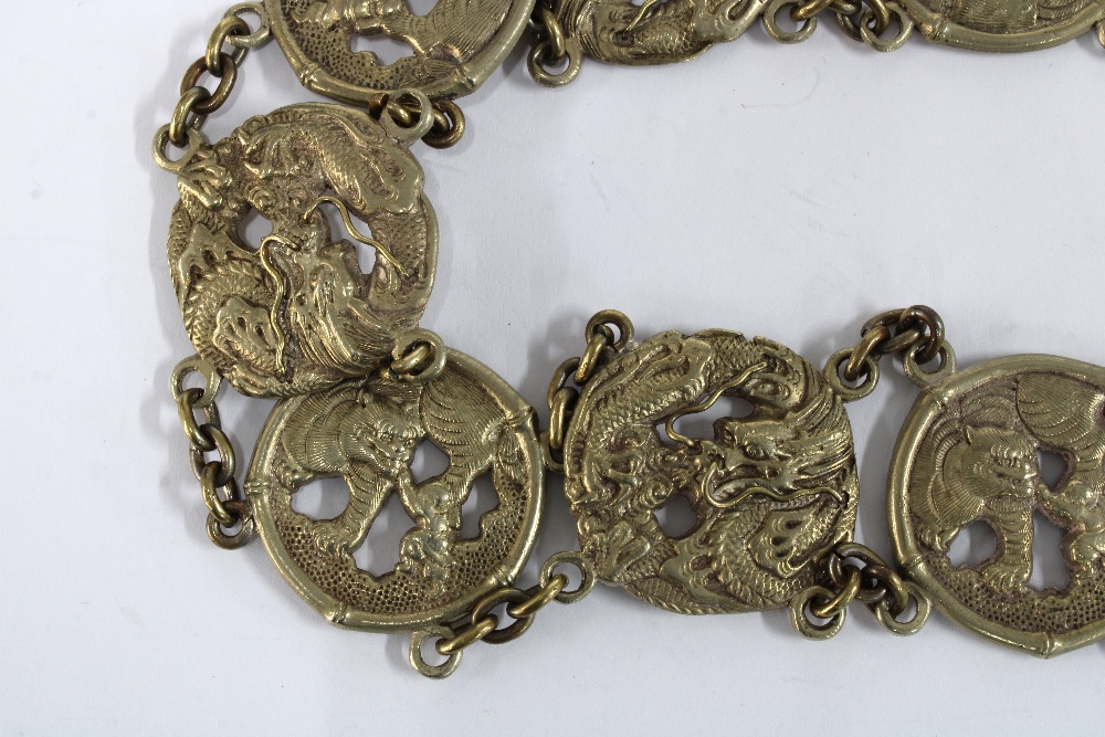 Chinese white metal belt, with thirteen dragon and Buddhistic lion panels with a central two part - Image 3 of 5