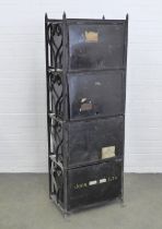 Solicitor's wrought iron Deed box rack together with a set of four black metal deed boxes, one