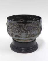 Indian silver bowl with a pattern of village life, stamped SILVER STERLING, with a pedestal base,