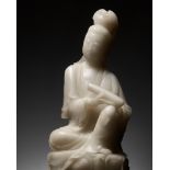 A CARVED ALABASTER FIGURE OF GUANYIN, LATE QING DYNASTY