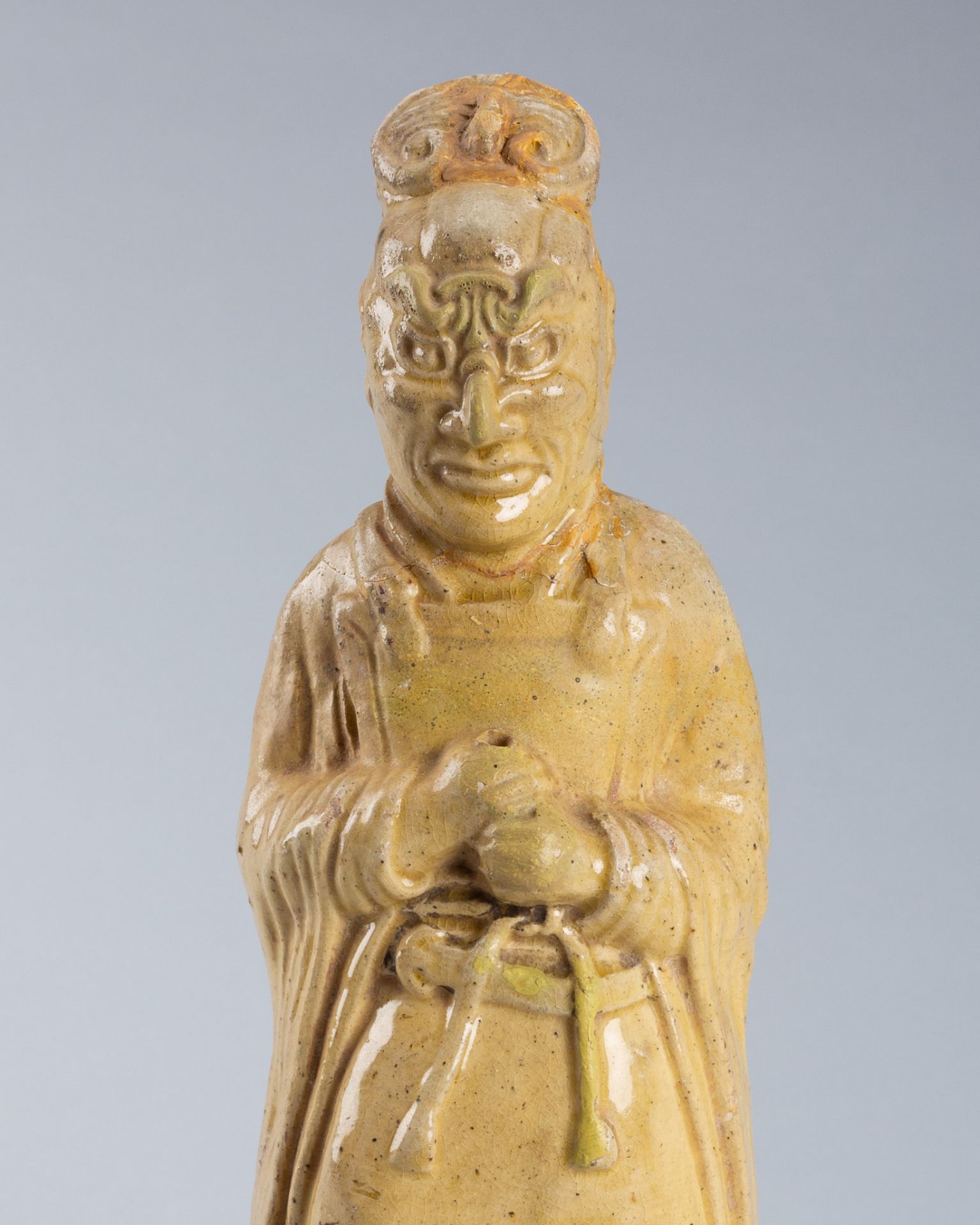 A STRAW GLAZED POTTERY FIGURE OF A TOMB GUARDIAN, SUI TO TANG DYNASTY