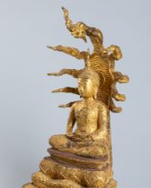 A GILT-BRONZE FIGURE OF BUDDHA MUCHALINDA SURROUNDED BY NAGA, 19TH CENTURY