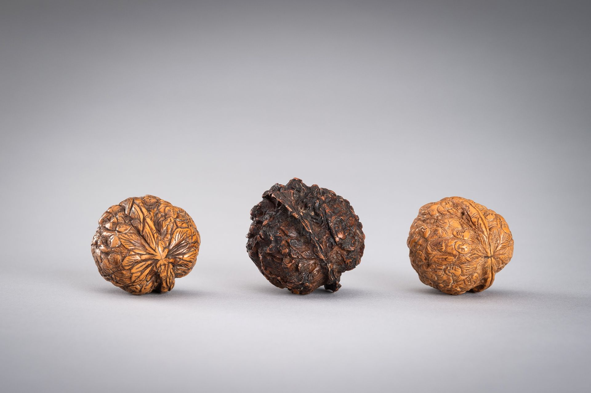 A GROUP OF THREE WALNUT CARVINGS, c. 19020s - Image 9 of 10