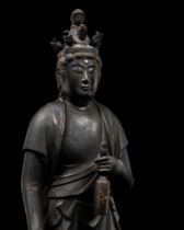 A RARE STANDING WOOD FIGURE OF JIUCHIMEN KANNON, LATE MUROMACHI TO EARLY EDO