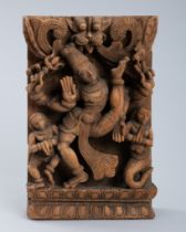 AN INDIAN WOOD RELIEF OF DANCING VISHNU