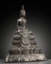 A SILVER REPOUSSE FIGURE OF BUDDHA SHAKYAMUNI, AYUTTHAYA STYLE