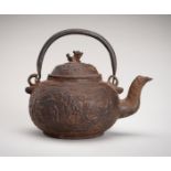 AN IRON TEAPOT DEPICTING SHOULAO AND CHILDREN, QING DYNASTY
