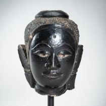 A LARGE LACQUERED SANDSTONE HEAD OF BUDDHA, 16th - 17th CENTURY