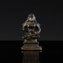 A MINIATURE BRONZE FIGURE OF ANNAPURNA