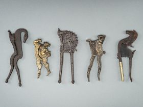 A GROUP OF FIVE BRONZE AND IRON BETEL NUT CUTTERS