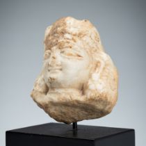 A SMALL MARBLE HEAD OF A FEMALE DEITY, KASHMIR, 10TH-12TH CENTURY